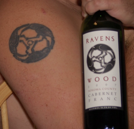 Ravenswood tattoo on arm